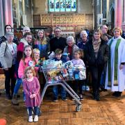 Vicar, Michael Smith and The Dean of Winchester, Catherine Ogle (who was leading the service) together with some members of the congregation and food collect