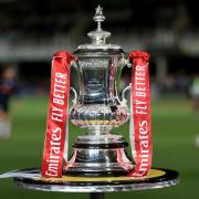 The FA Cup trophy on display ahead of a FA Cup first round match at Edgar Street, Hereford. Picture date: Friday November 4, 2022.