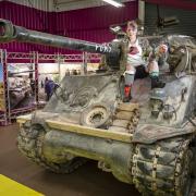 Tank Girl lookalike opens the Tanks for the Memories exhibition at The Tank Museum.