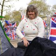 Kim Bilson, from Poole, who is already in position along The Mall in central London ahead of the coronation.