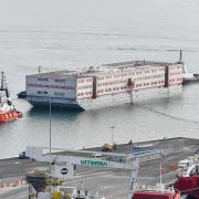 The Bibby Stockholm arriving at Portland Port