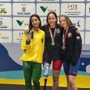 Isabella Haynes (centre) took gold in the 200m freestyle out in Brazil