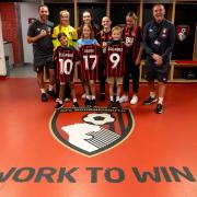 Eleanor, Leo and Sadie with AFCB players in the dressing room, with their new shirts.