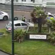 Driver arrested after crashing car into roundabout and fleeing scene
