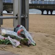 Floral tributes have been left on Bournemouth beach after the death of Amie Gray.