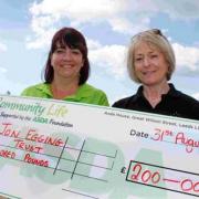 FUNDRAISERS: Dawn Egging, right, receives a cheque for £200, for the Jon Egging Trust, from Amanda Bailey.  Left, Jon Egging  Picture: Hattie Miles 15033542