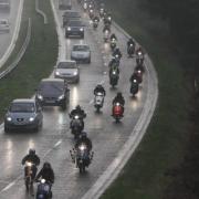 The convoy of scooters and motorcycles heads up the A338 spur road