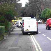 Parked on double yellow lines and in the cycle lane - but it's okay, these council vans have permission
