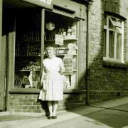 David's mother Winifred outside her shop in Fordington