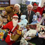 Phil Carey and Daily Echo staff with donations to the toy appeal