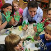 Lib Dem leader Nick Clegg gets his hands dirty when he visits Tops day Nursery in Corfe Mullen with North Poole and Mid Dorset candidate Vikki Slade. RC270415pCleggtops -   PICTURE BY RICHARD CREASE (24424649)