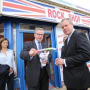 SWEETENER: Michael Gove presents MP Conor Burns with a stick of rock