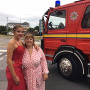 SURPRISE: Mum Charlotte Giddins with her daughter Emily-May Giddins outside the Royal Bournemouth Hospital, a diversion on her way to prom. Picture: Howard Matthews