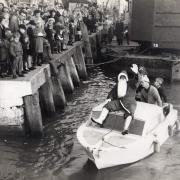 William Meads (in the while bottle hat on the boat) during a visit from Santa at Poole Quay