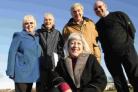 PLEASED: Members of the Parkstone Bay Association who are trying to protect Whitecliff and Baiter recreation grounds from future development. The association’s vice-chair Eunice Marsden, is pictured at the front