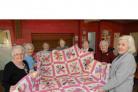 Florrie Tobin, Anne Carrington, Nan Collins, Violet Morrissey, Vicky Webb, Myra Rich and Anne Bowen with their quilt