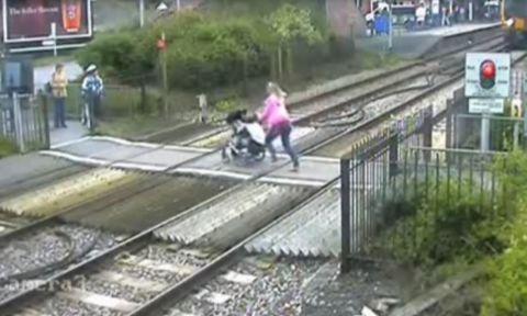 A woman with a pushchair on the crossing before safety improvements were introduced