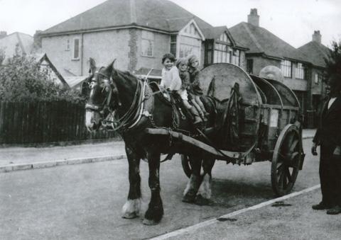  Children on dustcart in Saxonbury Road, Tuckton circa 1940-42. Submitted by Mrs Jean Lees. Left to right, John Bramwell, Jean and her identical twin Ann Stockley. Dustman on far right Mr Rodaway of Southbourne.