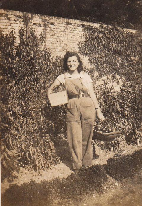Vera Rose Rae working in the gardens at Upton House in the summer of 1942. She worked there during the war, having trained at Seale Hayne Agricultural College at Newton Abbot. After her death a tree was planted in the gardens in her memory.