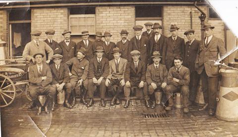 Employees outside Malmesbury Park Diaries. Harry Charles is seen back row right.
