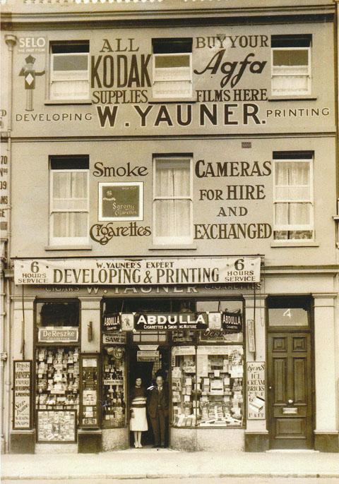 Woolf Yauner and daughter Betty in the doorway of his shop at Landsdowne Crescent