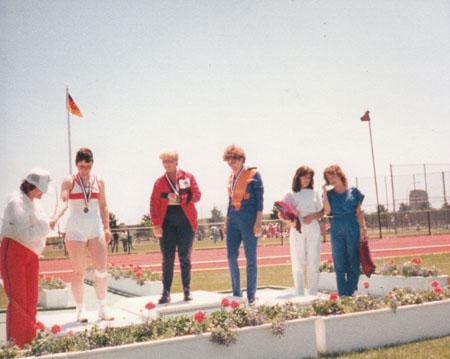Janice Moores, later became Janice Watson, won gold for Great Britain in the Javelin event for the partially sighted in the Paralympics in June 1984 at Long Island, New York. She is seen here with the two Eastern German contestants who came 2nd and 3rd, a