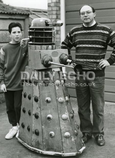 Tony Greening, Dr Who fan. Made his own replica Darlek. Seen here with his son Mark, 1989.