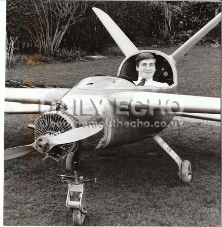 Rod Atkins and his father Vic built a prototype fibreglass aircraft in their garage at Colehill. Rod tries out the plane for size.