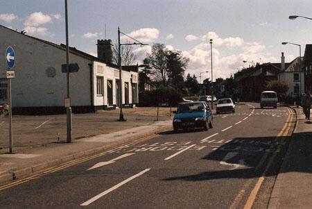 Richard Chambers of Wimborne took this picture of Rodways Corner in Wimborne in 1989, before the Quarterjack Surgery was built. It shows Rodways Garage where the surgery is now. It also shows traffic going towards the town which is opposite from the way t