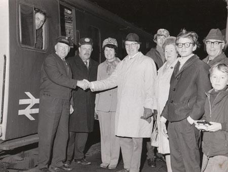 In 1972 Johnnie Walker, Mrs Langford, Cllr and Mrs E Mole in the centre bid farewell to the last train to leave  Wareham when the station closed.