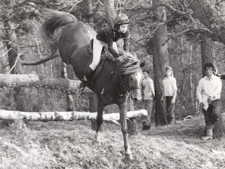 In 1979 Jane Hall of Corfe Castle clears a woodland jump during the Wareham hunter trials in aid of Swanage and Herston football club building fund.