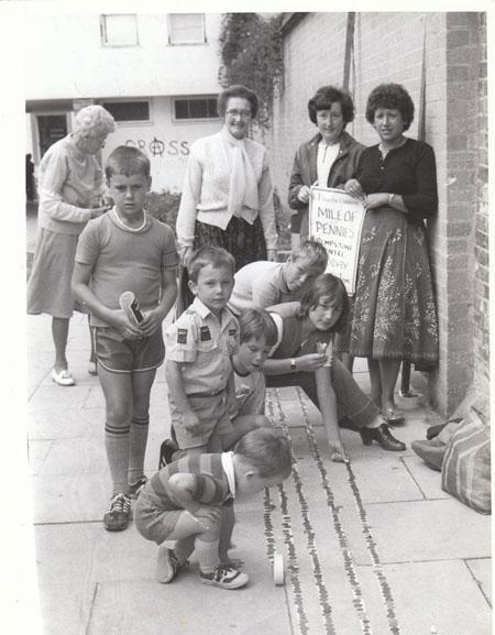 In August 1982 it was a case of children helping children at the Rempstone Centre at Wareham. The local branch of the Save the Children Fund organised a mile of pennies on the pavement.