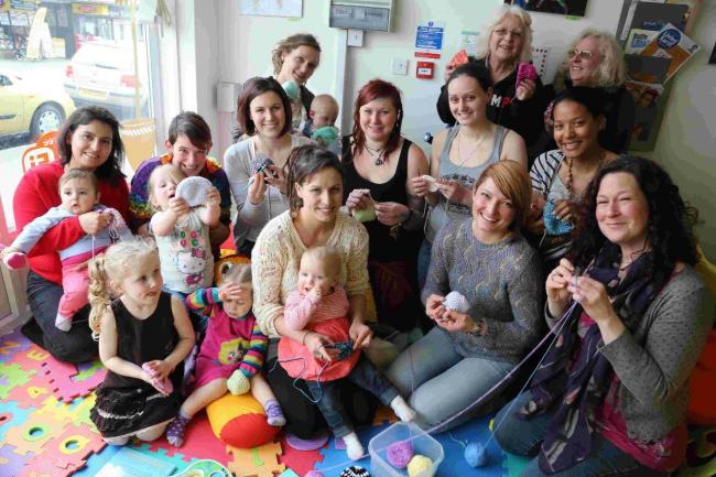 FUNDING BID: Jamii Carmen Prince, front centre, and, centre right, Yummy Mummys creative cafe owner Kasia Mistrzak and volunteers who had spent the day crocheting hats