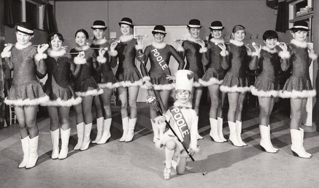 Poole Majorettes in 1981. The troupe of over 49 performing members won the Battle of the Flowers in Jersey that year,competing against troupes from all over Britain and Europe. Founder and trainer was Mrs Janetta Mizen of Poole.