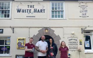 CJ and his partner, Anne Marie (centre) with new staff at The White Hart