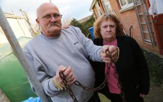 Colin and Linda Pidgley, grandparents of Jade Clark, with the chain that had been used to lock the scooter to a post. Picture: Corin Messer