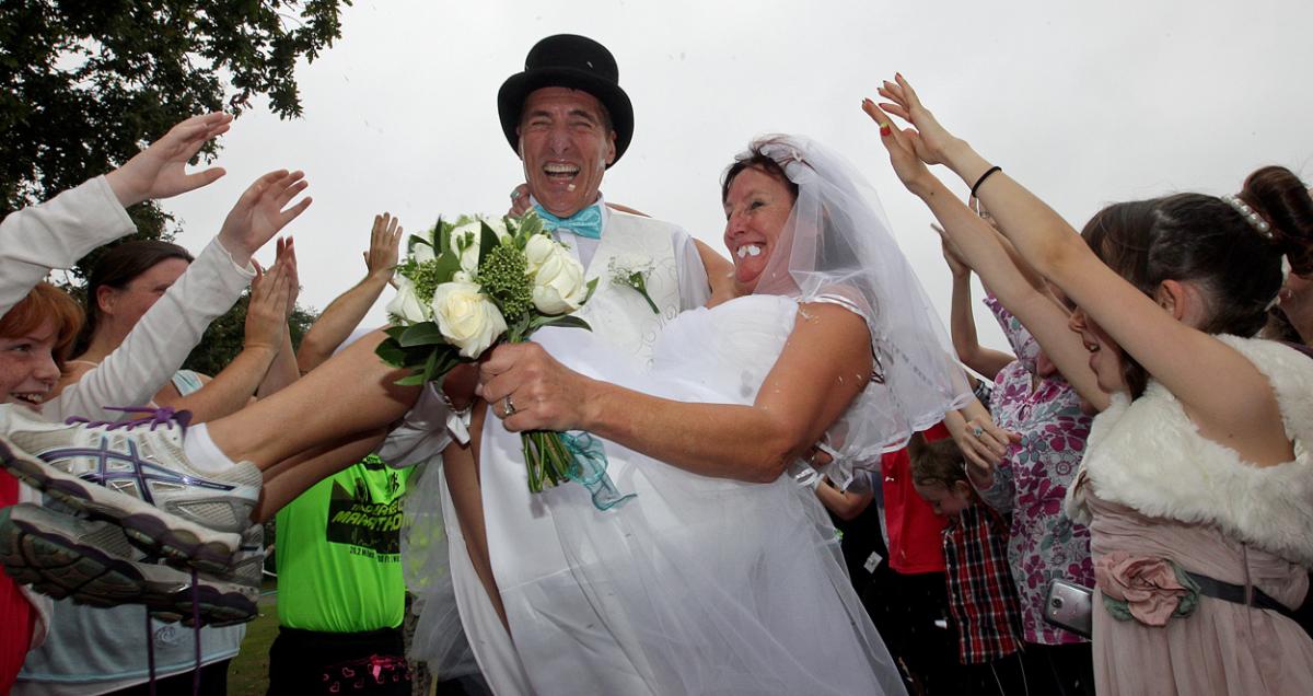 Keen runners Eve Carter and Graham Filmer tie the knot during the Poole parkrun. Photos by Sally Adams. 