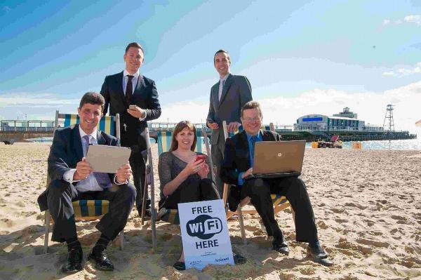 SITTING PRETTY: Cllr Mike Greene, Adam Troman, MD of Fusion WiFi, Tina Stokes, Media & communications officer for Bournemouth Borough Council, Simon Waters, Marketing Manager at Fusion WiFi, Cllr John Beesley