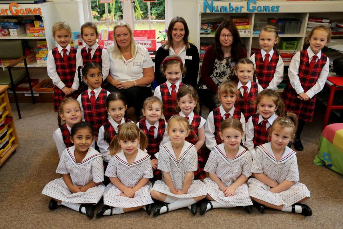 Talbot Heath School reception class pupils with, left to right, teacher Mandy Pidgley, TA Nicola French and classroom assistant Veronica Rose.