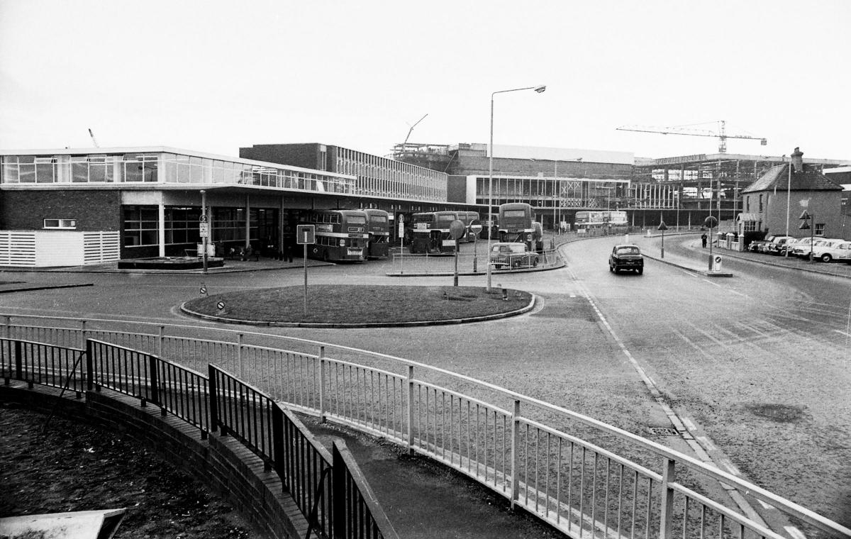 The Arndale Centre being built in 1970, Poole Bus station  and to the right the building that was demolished to make way for the Arts Centre.