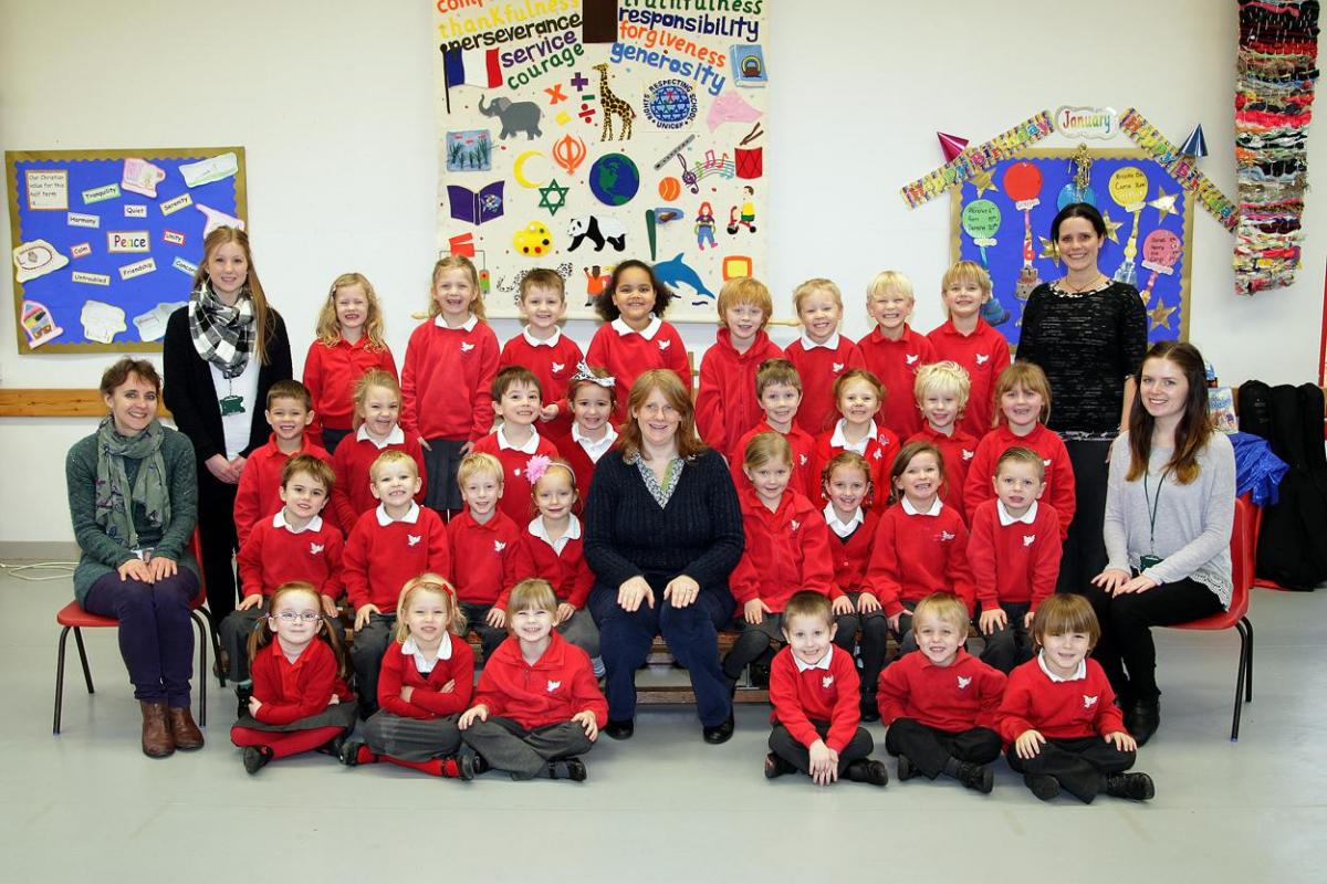 Reception class at St John's First School. Pictured are teacher Jo Hancock, centre, TA Claire Ellis, front left, TA Emily Tilley, back left, TA Laura Scott, front right and TA Kate Kemp, back right.