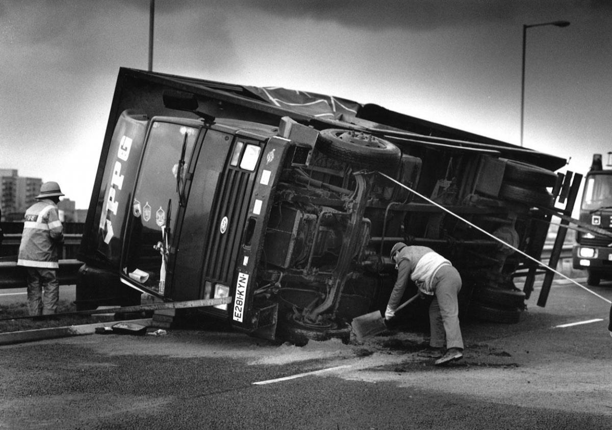 A truck is overturned at Holes Bay in Poole during a storm in February 1990. 

