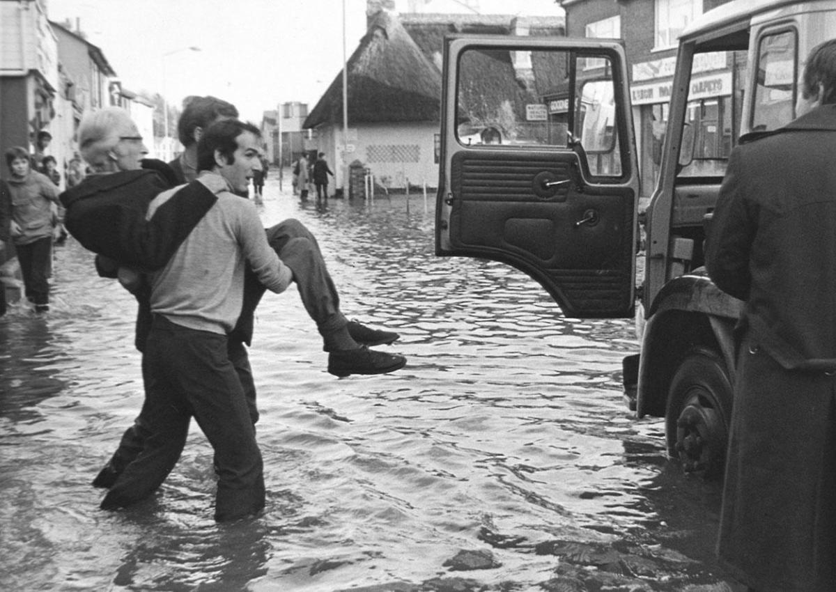 Donald Figg is carried to safety when Wimborne flooded  after the storm of 1979.