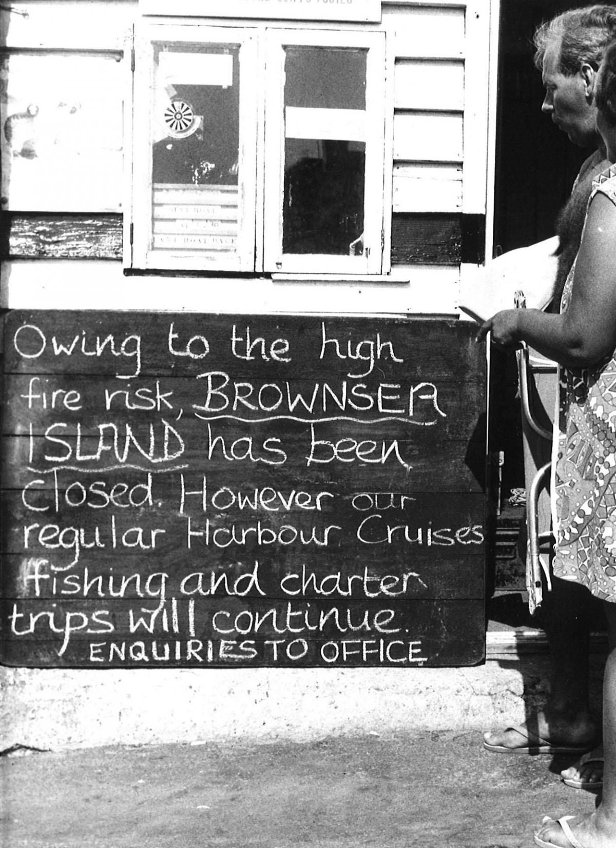 A National Trust sign warns holidaymakers that Brownsea Island has been closed due to the heatwave baking the country in the summer of 1976.