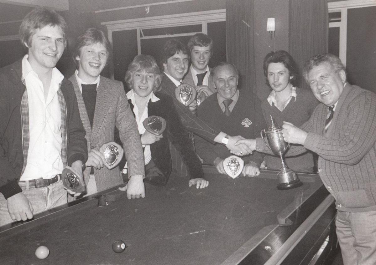 In 1979 Ferry Boat Inn B team were winners of the Swanage Pool League. George Davidson, chairman gives the trophy to Andy Graham with Derek Barnes, A. Keates, Steve Wyatt, A. Crooks, T.Saunders and the landlord Ken Truswell.