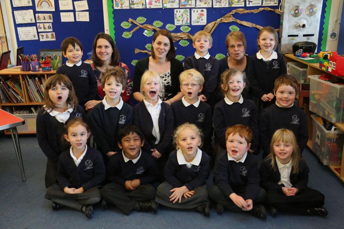  Reception class pupils at Shillingstone Primary School with, left to right, 121 TA Michelle Lowe, teacher Nicky Bray and TA Pauline Long. 
