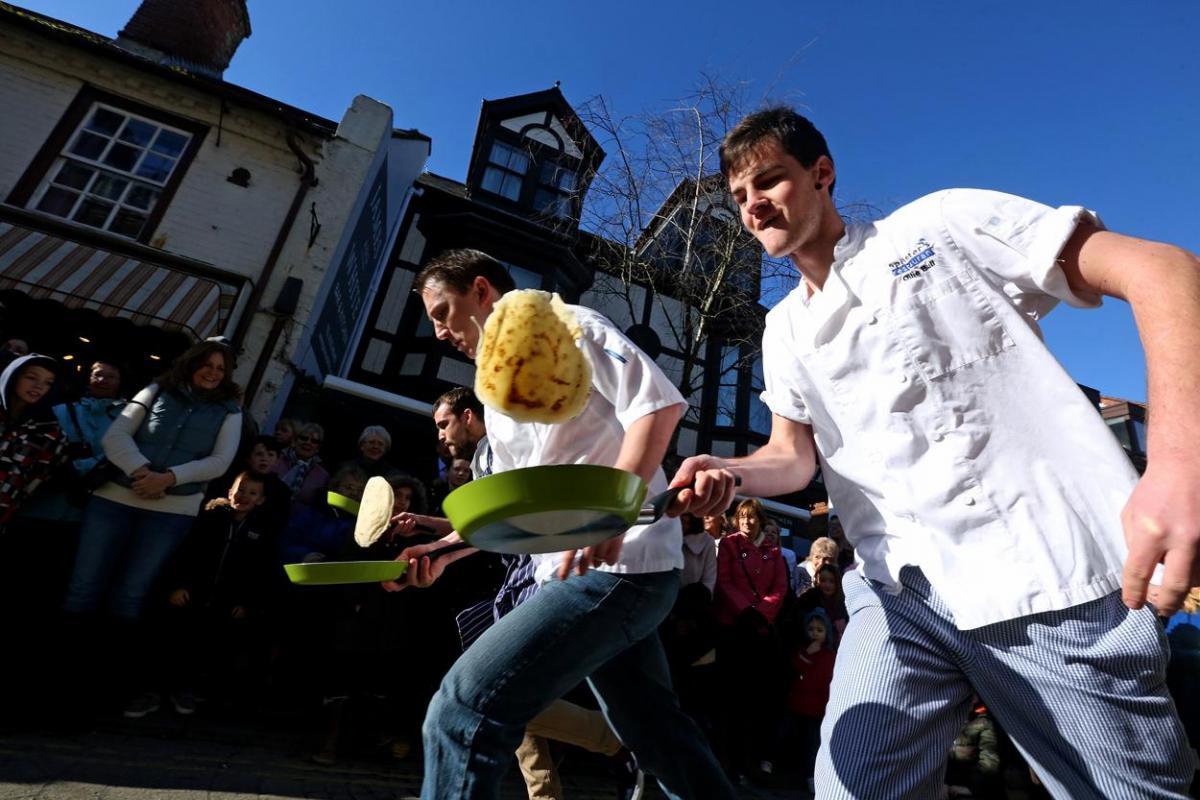 Pancake Day races take place in Christchurch on Shrove Tuesday. Pictures by Sally Adams.