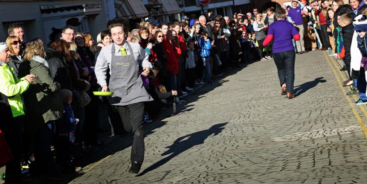 Pancake Day races take place in Christchurch on Shrove Tuesday. Pictures by Sally Adams.