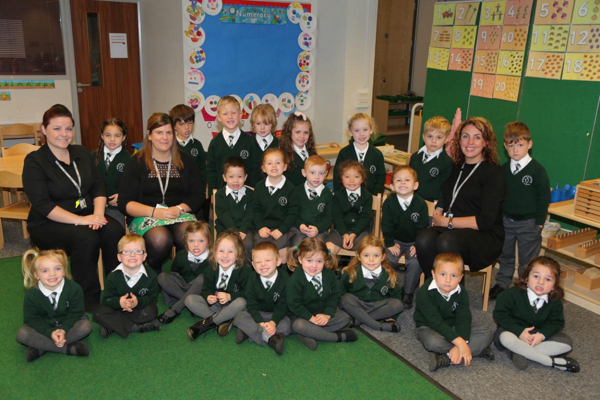 Reception children at Parkfield School in Bournemouth with, from left, TA Jemma May, teacher Charlotte Goodrum and montessori teacher Tania Ware.
