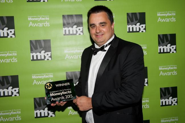 Allan Cruse,  principal partner with Strategic Solutions, collects its award for Moneyfacts Investment Adviser of the Year